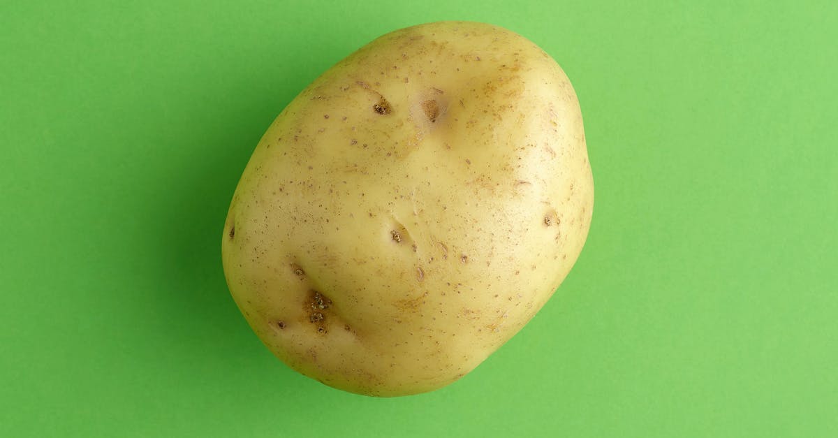 How much does a "large" potato weigh? - White Round Fruit on Green Surface