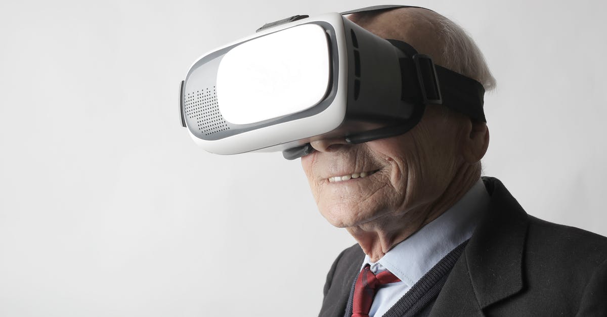 How much experience is needed to work in a restaurant? - Smiling elderly gentleman wearing classy suit experiencing virtual reality while using modern headset on white background