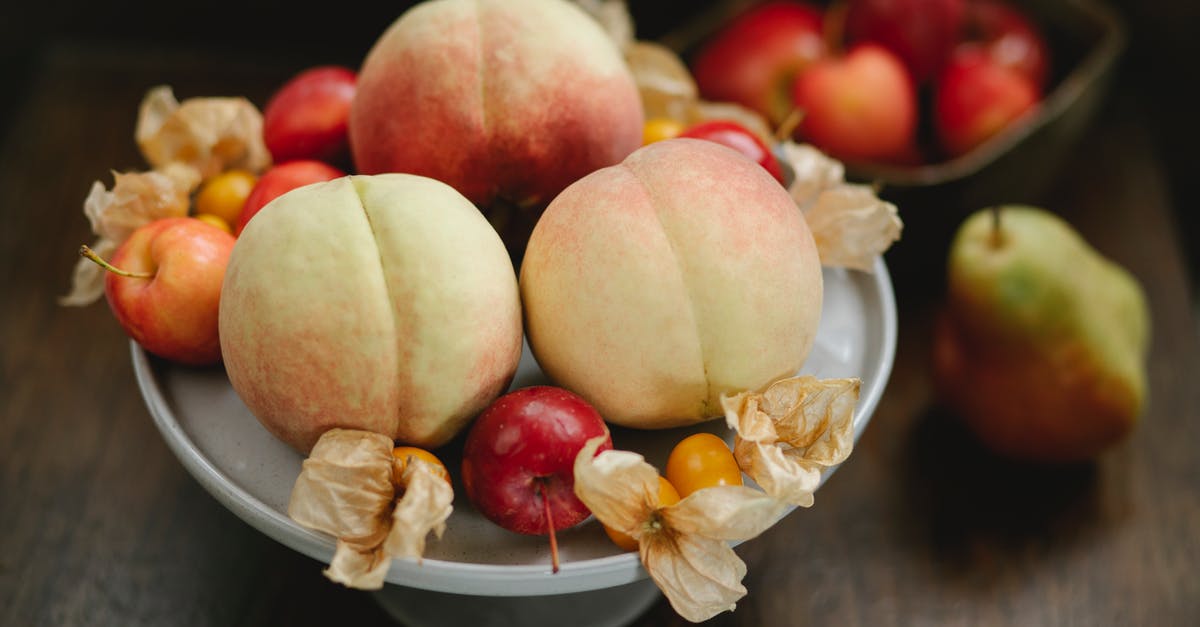 How much juice is in 1 pear - Delicious peaches apples and cape gooseberries on table