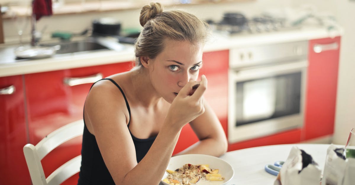 How much oats to put in crumble topping? [closed] - Woman in Black Tank Top Eating Cereals