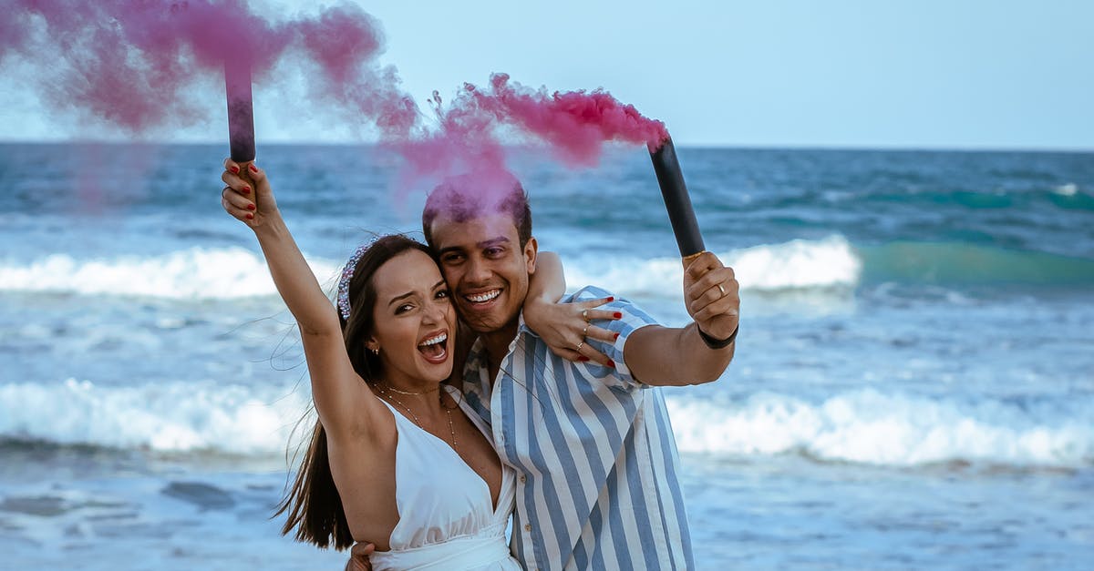 How much smoke to expect from making a roux? - Happy pregnant couple with pink smoke bombs