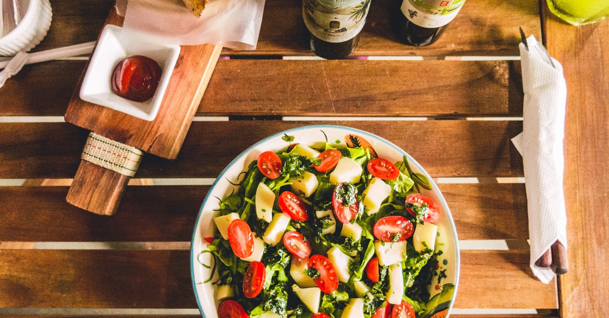 How oil changes the taste of salads? - Healthy vegetable salad with cherry tomatoes and mix leaves