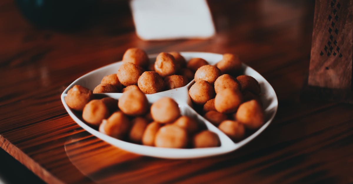 How should I roast bay nuts? - Roasted salty nuts on white plate served on table