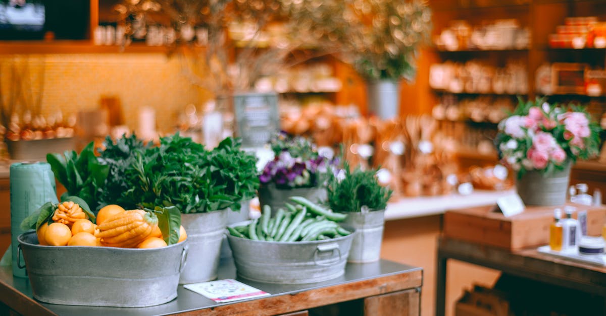 How should I store herb butter? - Assorted fresh vegetables and herbs in iron containers on table in modern store