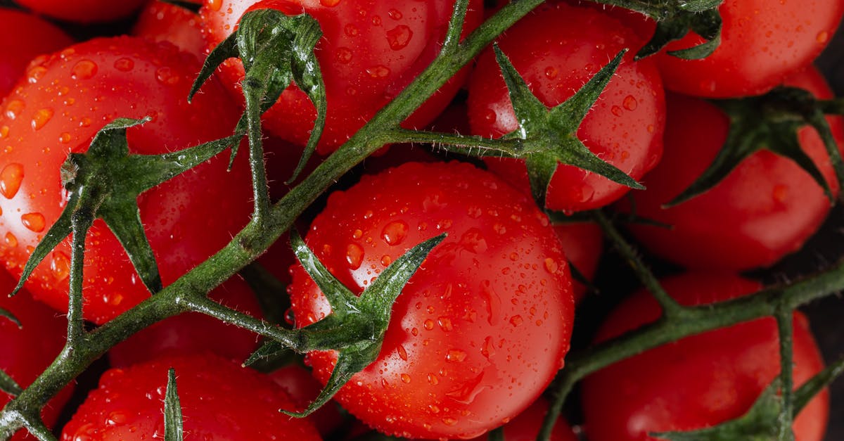 How should I store raw steaks in the freezer? - Fresh ripe red tomatoes with water drops