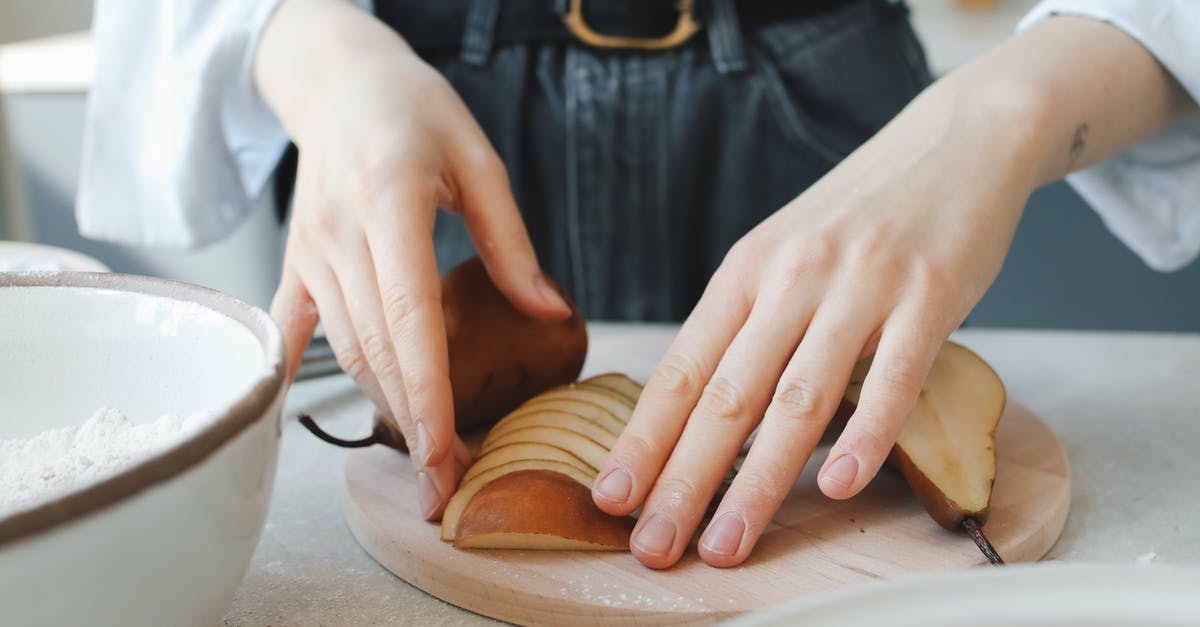 How should I store vacuum-sealed sliced salami? - Person Holding White Ceramic Bowl