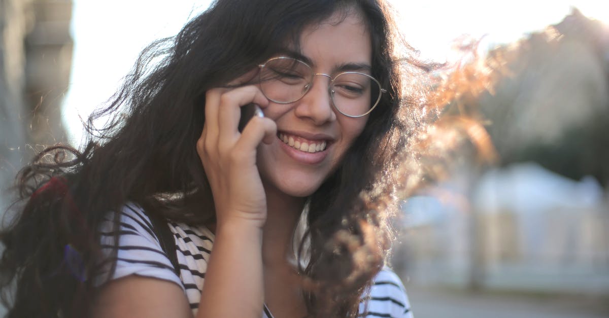 How should I use extra summer squash? - Cheerful young woman making phone call on street