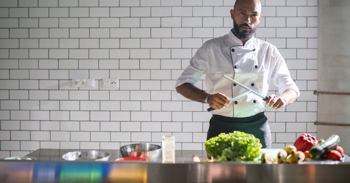 How should swordfish be prepared? - Man in Gray Dress Shirt Holding Chopsticks