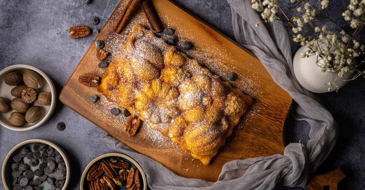 How to Avoid Soggy Chopped Nuts in Baked Goods - Flatlay of a Delicious Bread on Brown Wooden Chopping Board