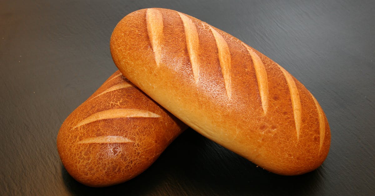 How to avoid stiffness and crispness of toasted/oven baked bread sandwiches - Two Brown Baked Breads on Table