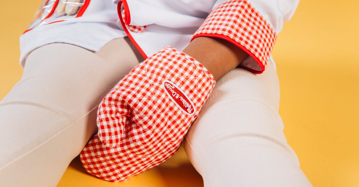 How to bake without an oven? [duplicate] - Little child wearing chef uniform with oven glove