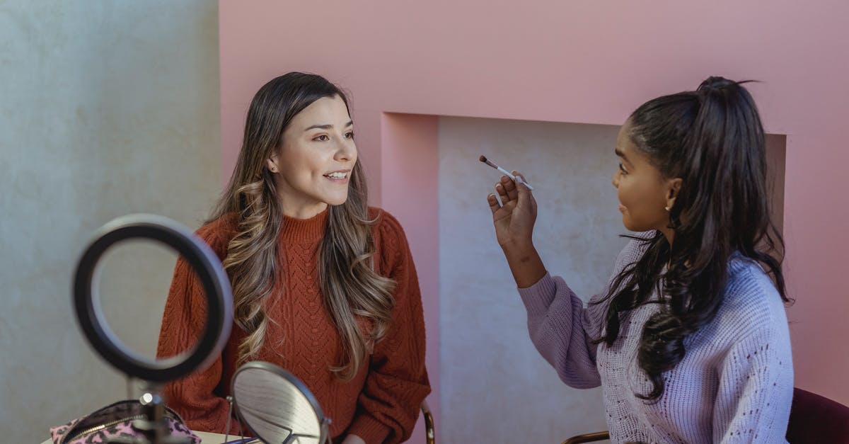 How to best prepare Sukimono - Young black woman applying makeup on face of friend