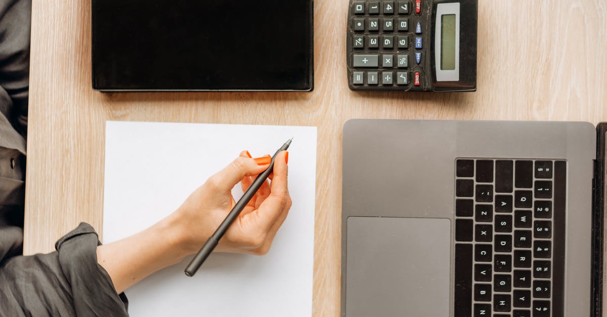 How to Calculate Scoville Heat? - Person Holding a Pen on Top of a Desk