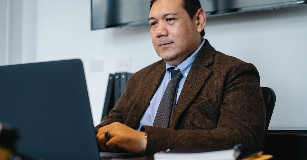 How to calibrate Polder instant read thermometer? - Focused ethnic businessman using netbook while working in office