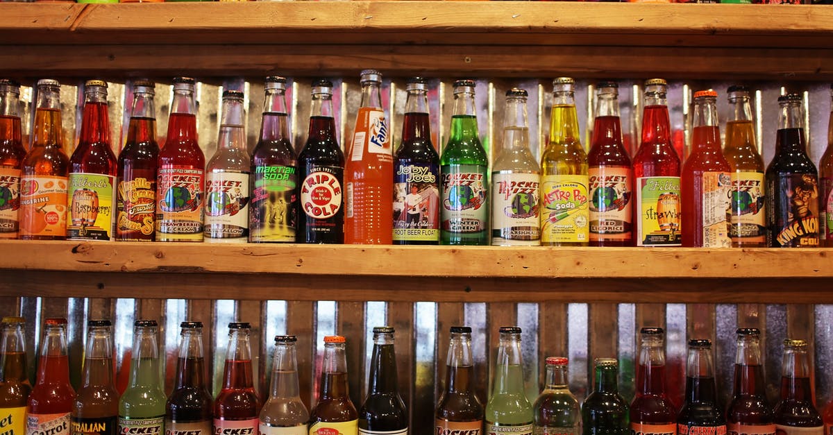 How to carbonate a drink? - Colorful bottles of soda pop on store shelf