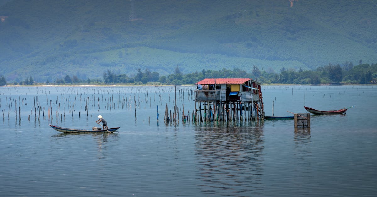 How to catch culture out of yogurt? - Unrecognizable fisherman catching fish in river from boat