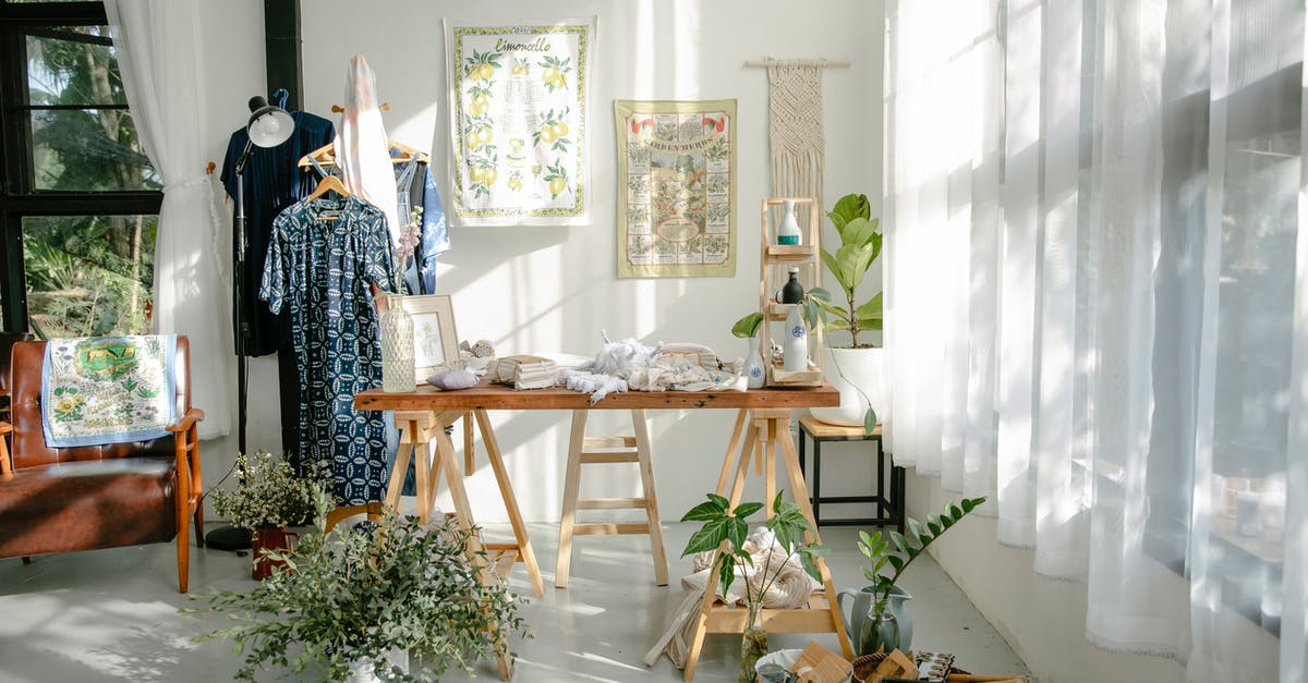 How to clean a big butcher block? - Interior of atelier with table and clothes on hangers