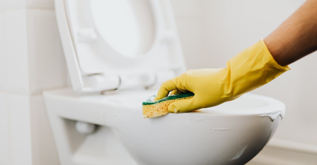 How to clean aluminum with lye "stains" - Crop cleaner in rubber glove wiping toilet rim