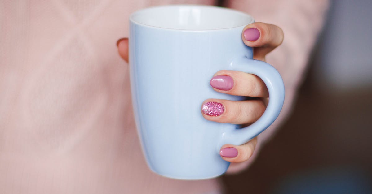 How to clean ginger for tea - Person Holding White Ceramic Mug