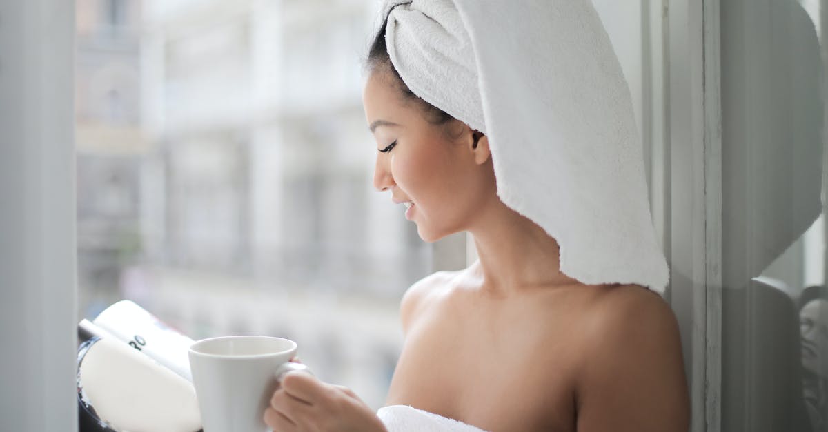 How to clean ginger for tea - Woman Reading Magazine Near Glass Window