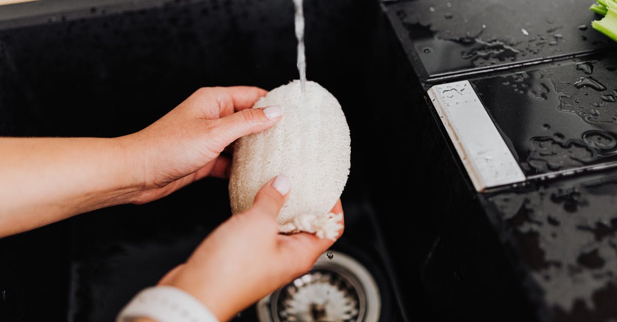 How to clean/wash (Sichuan) peppercorns? - Black Sink and White Sponge in Hands