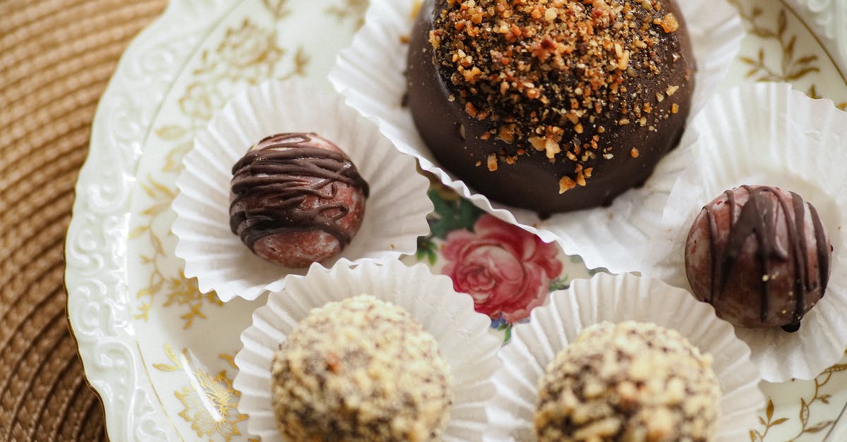 how to coat truffles with chocolate - Chocolate Truffles Served on Plate