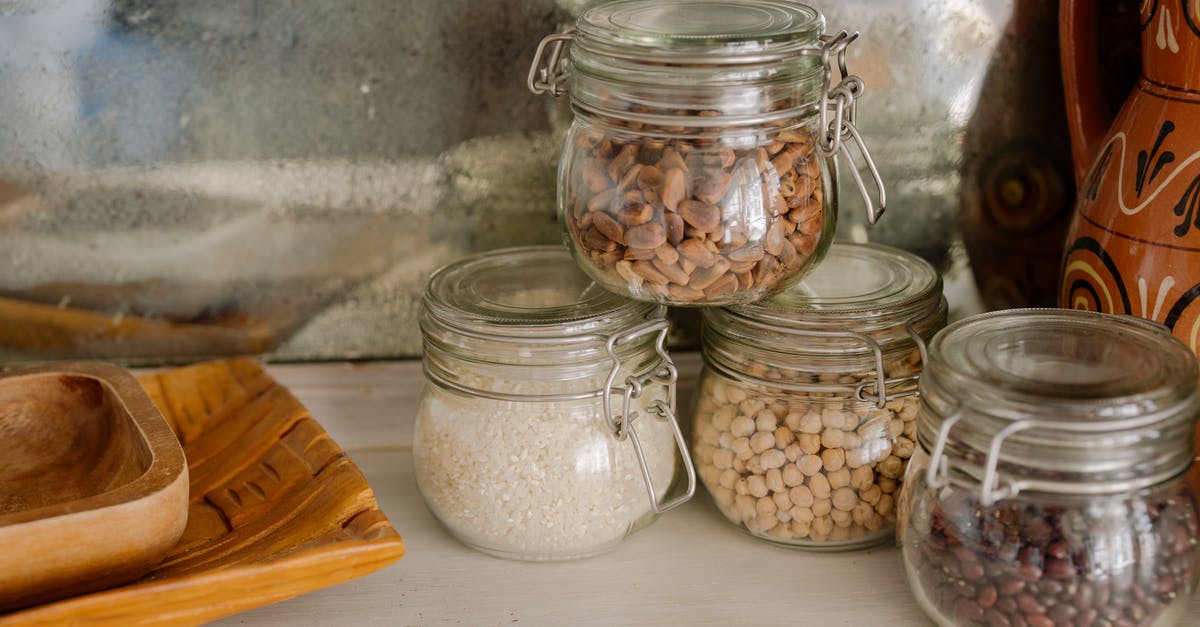 How to contain trash/waste food smells? - Clear Glass Jars on White Wooden Table