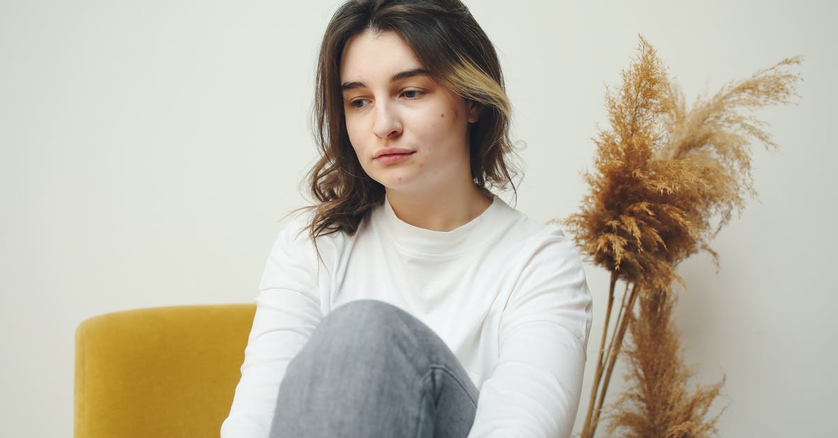 How to counteract excessive saltiness in dried fish? - Woman in White Crew Neck Long Sleeve Shirt Sitting on Yellow Chair