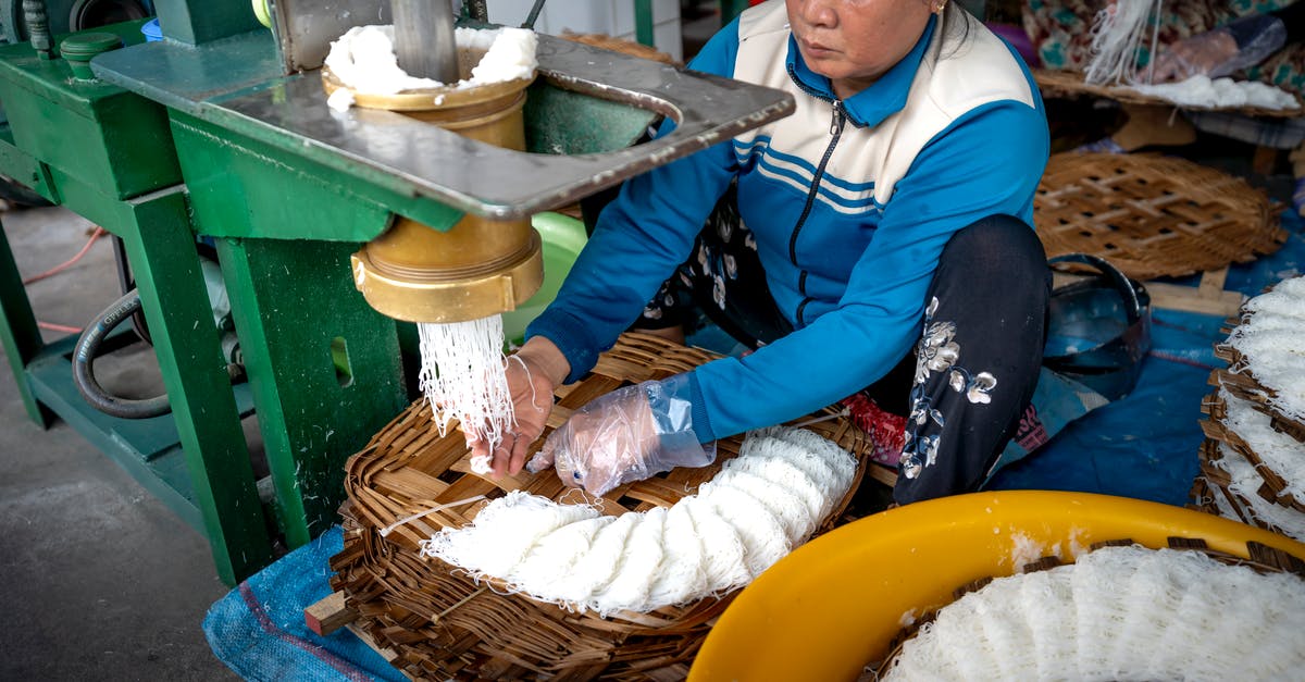 How to create the best veg noodles? - Ethnic woman making noodle in manufacture