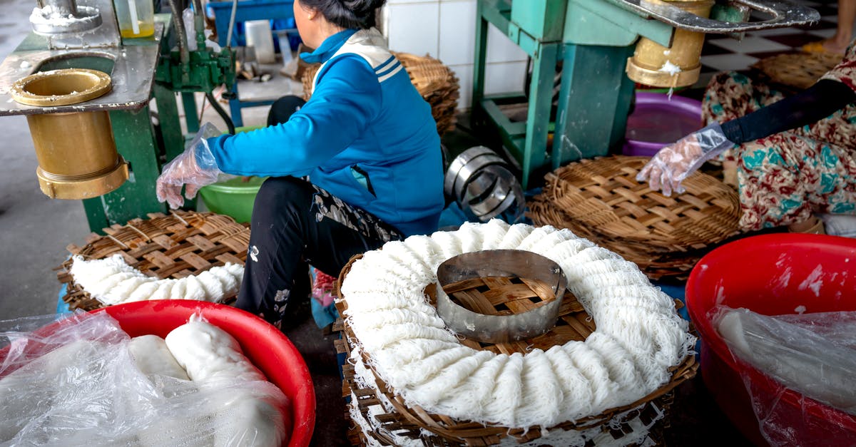 How to create the best veg noodles? - Faceless ladies making noodle in factory on machines