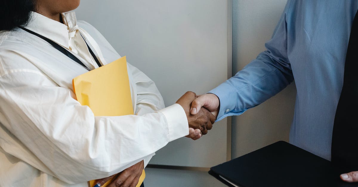 How to deal with mold on pickle? - Diverse coworkers shaking hands after meeting