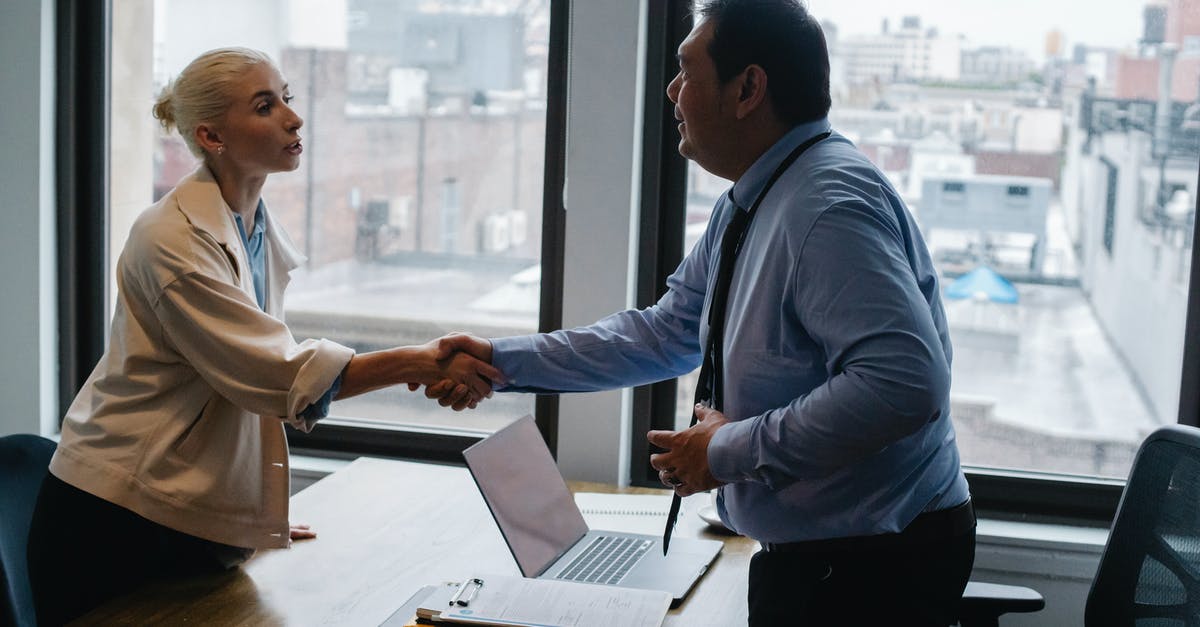 How to deal with mold on pickle? - Young woman shaking hands with boss after business presentation