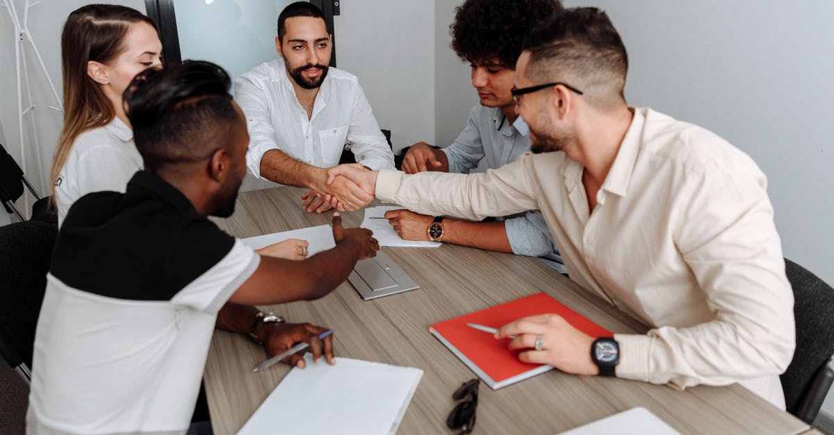 How to deal with strong, sizable spices? - Man in White Dress Shirt Sitting Beside Man in Black Dress Shirt