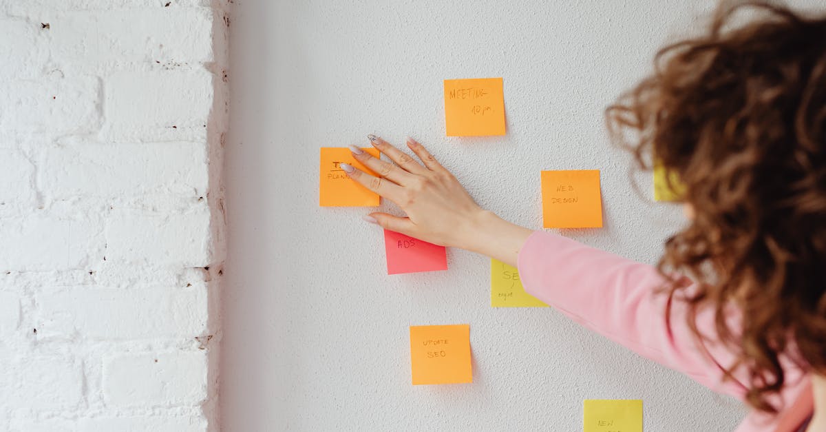 How to decrease sticking during frying without adding fats - Woman in Pink Long Sleeve Shirt Sticking Post Its on the Wall