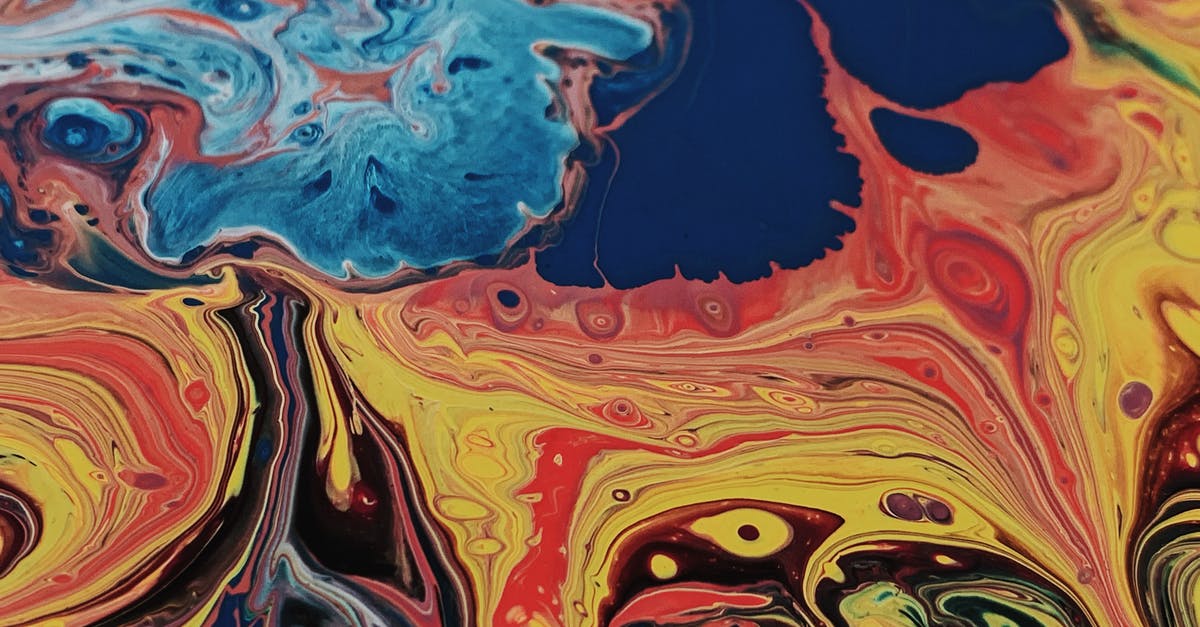 How to do icing swirl effect (a bit like marbling)? - Mixed bright yellow and red paints spill against different saturation blue paints on canvas