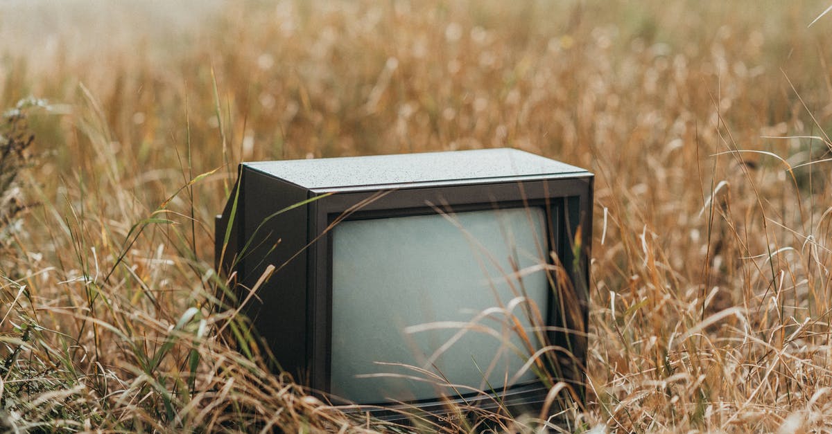 How to dry out rehydrated dried mangos? - Small black obsolete old fashioned television placed on withered dry grass on street against blurred background in countryside in nature