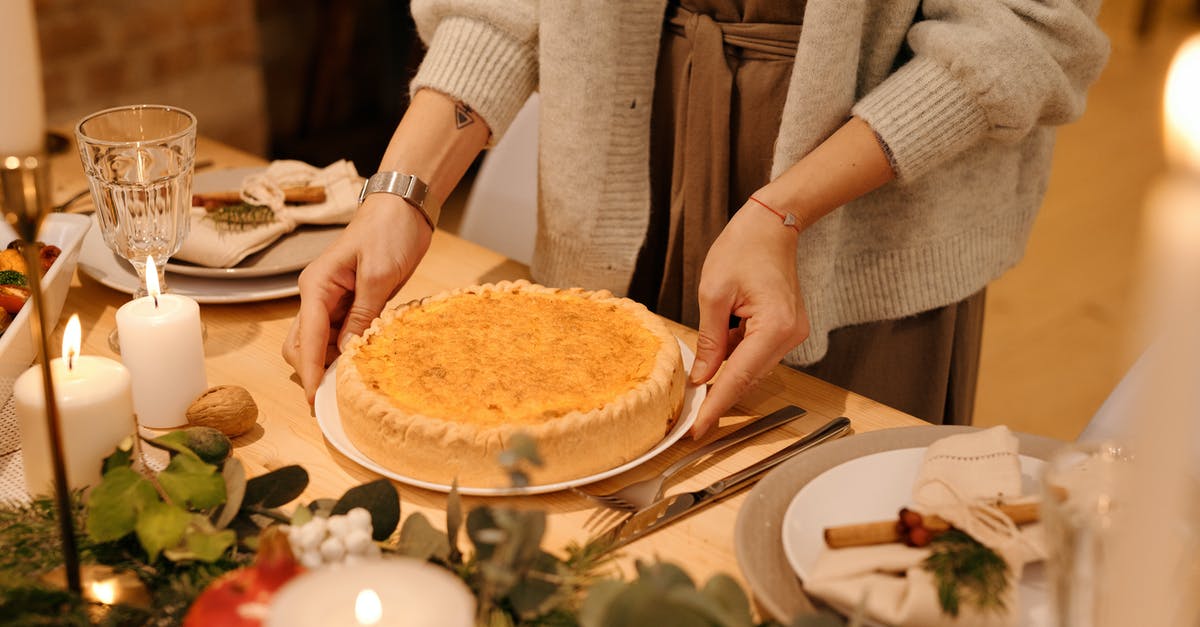 How to evenly bake a daquoise disk? - Person Serving a Cake for Christmas Dinner