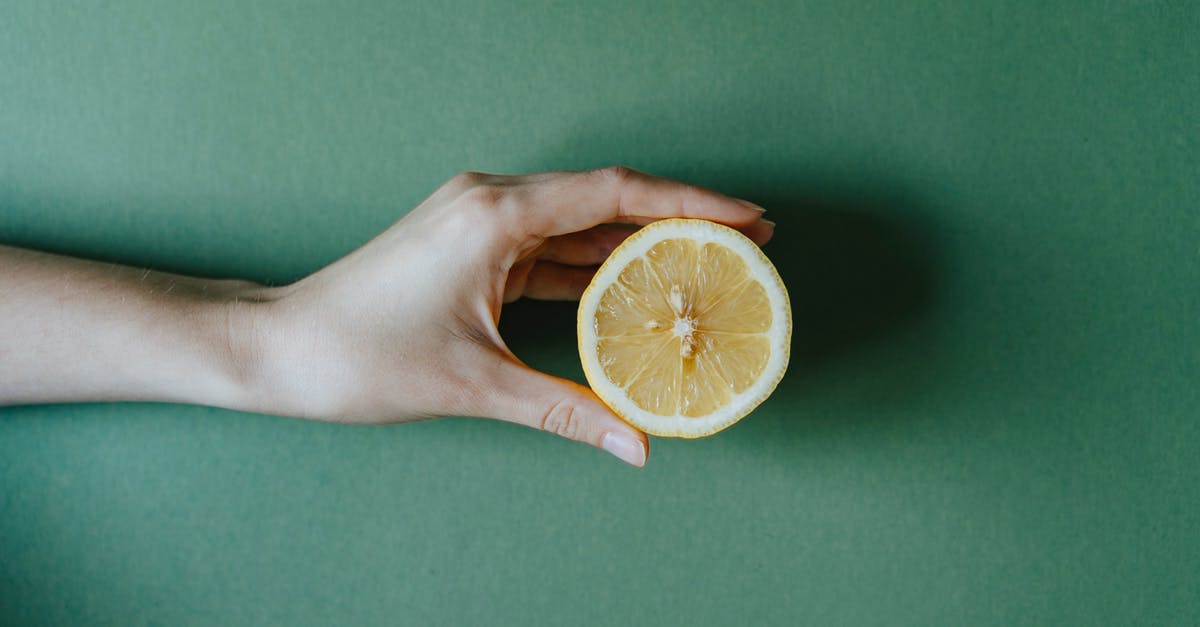 How to extend the freshness of salsa? - Person Holding Sliced Orange Fruit