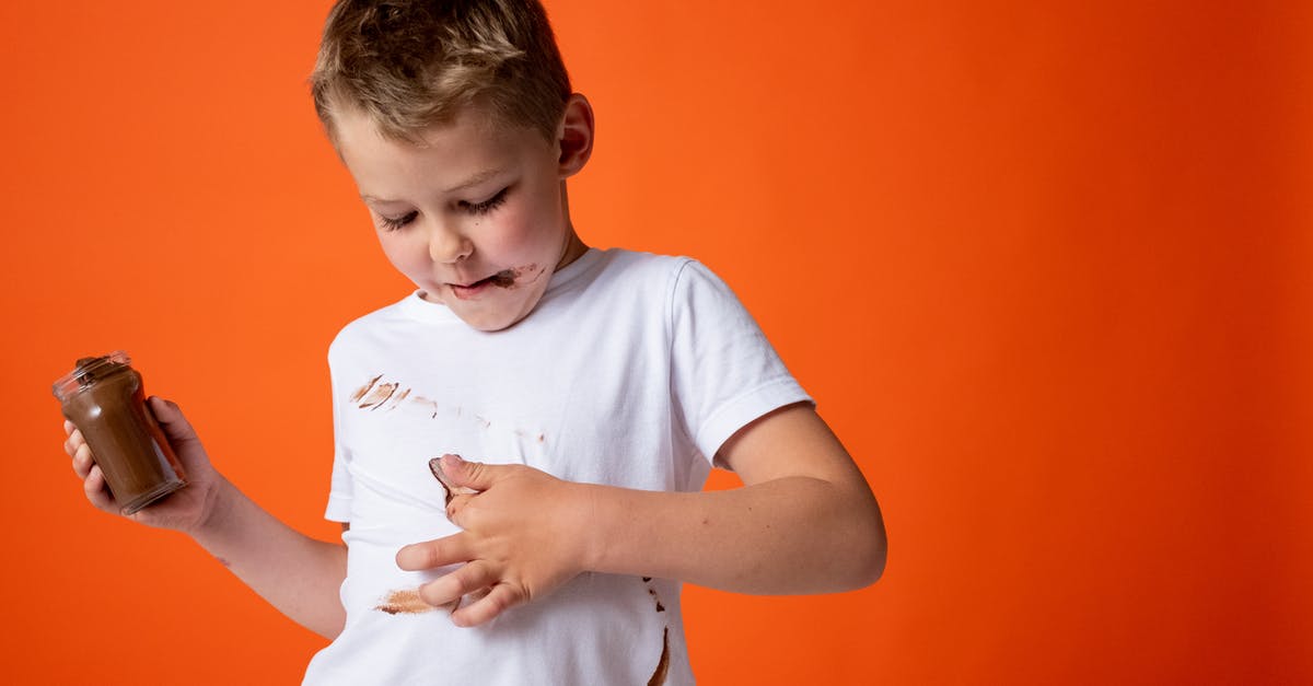 How to fix oily modeling chocolate - Boy in White Crew Neck T-shirt Holding Chocolate Jar