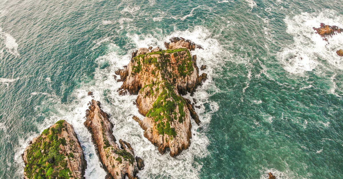 How to flake rock sea salt? - Rock Islands in Splashing Ocean