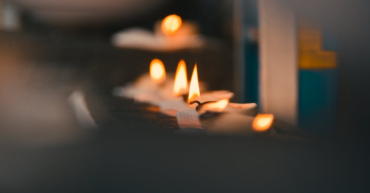 How to fry in a wok without burning oil? - Selective Focus Photography of Lighted Tealights