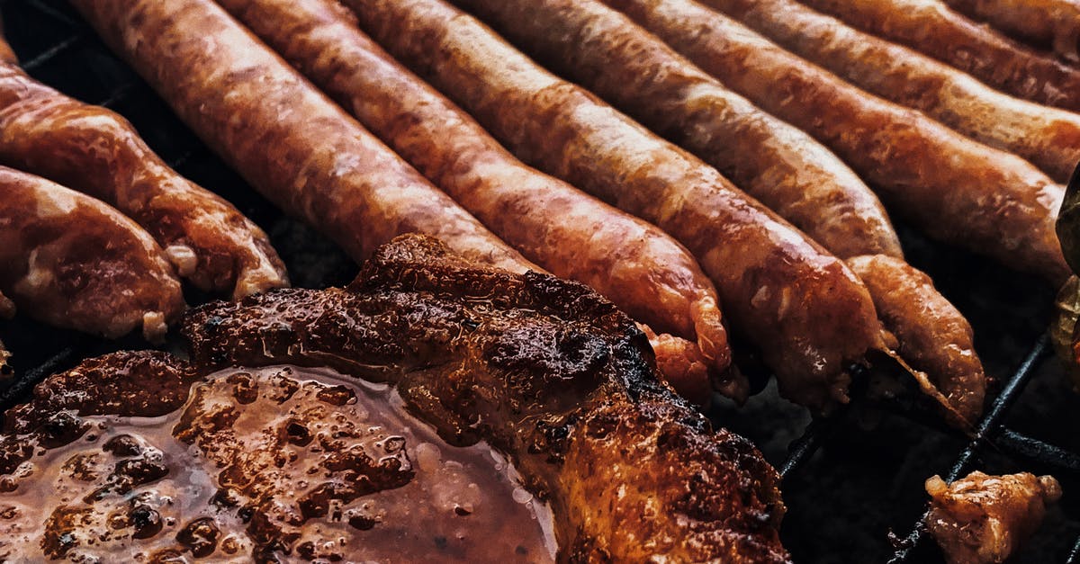 How to fry Italian sausages without producing so much smoke? - Yummy juicy steak and sausages grilling on barbecue