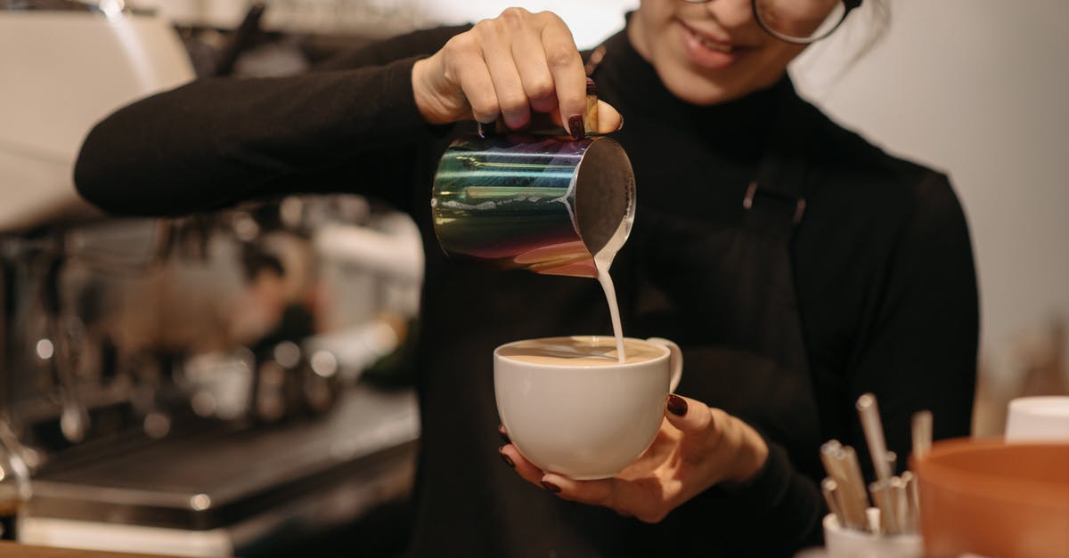 How to garnish coffee with cream - A Female Barista Making Coffee