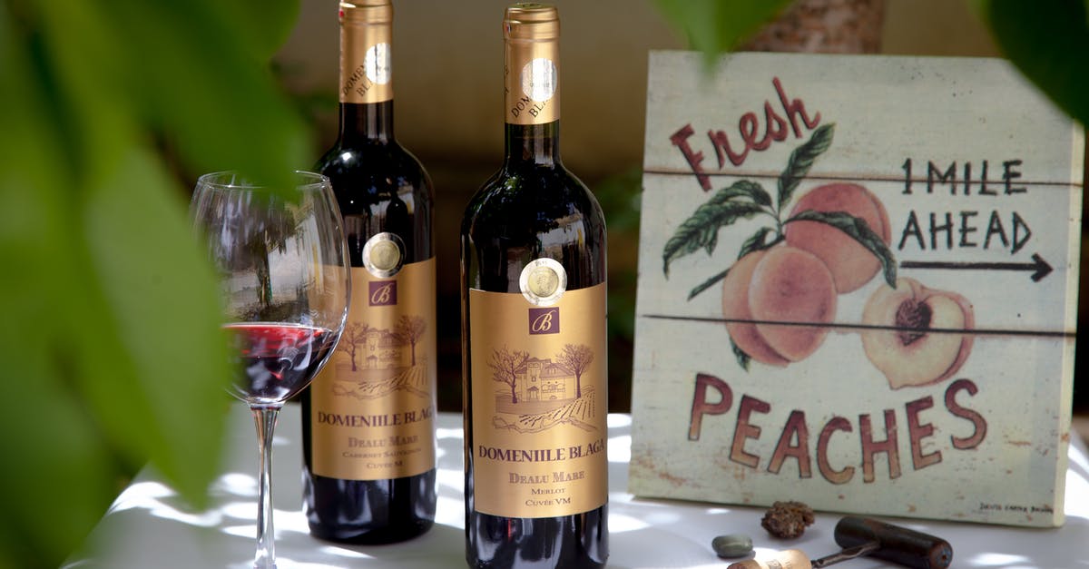 How to get a synthetic cork back in a wine bottle? - Two Red Wine Bottles Beside Clear Wine Glass How to get a synthetic cork back in a wine bottle? - Two Red Wine Bottles Beside Clear Wine Glass