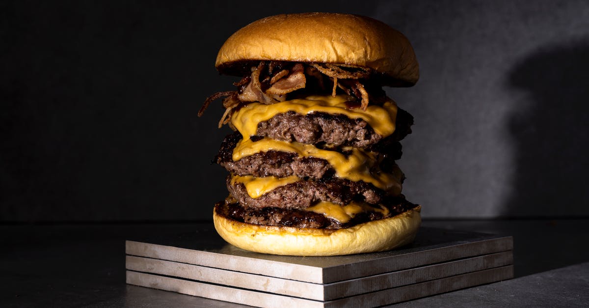 How to get moist goo in layers of chelsea buns - Studio Shot of a Multi-Layered Cheeseburger