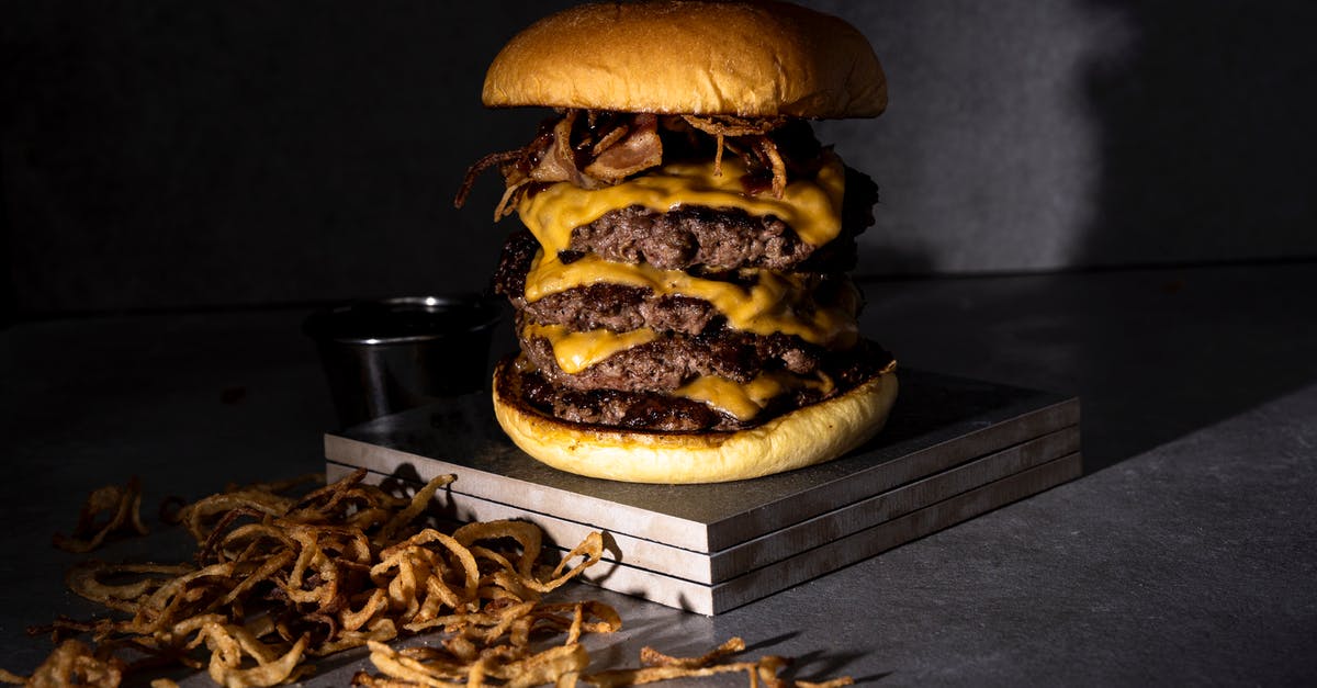 How to get moist goo in layers of chelsea buns - Studio Shot of a Multi-Layered Cheeseburger and Fried Onions