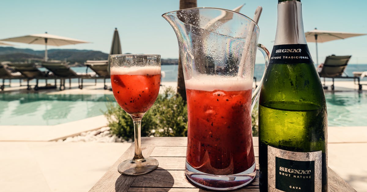 How to get rid of foam on shaken cocktails - Photo Of Wine Bottle On Top Of Wooden Table