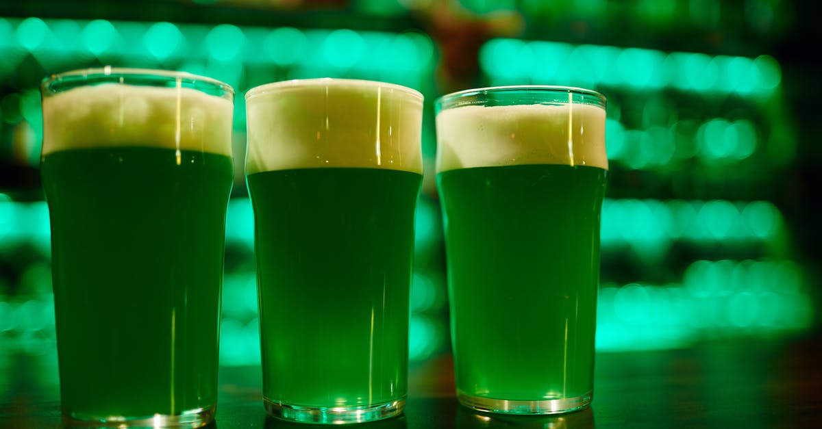 How to get rid of foam on shaken cocktails - 3 Clear Drinking Glasses With Green Beer