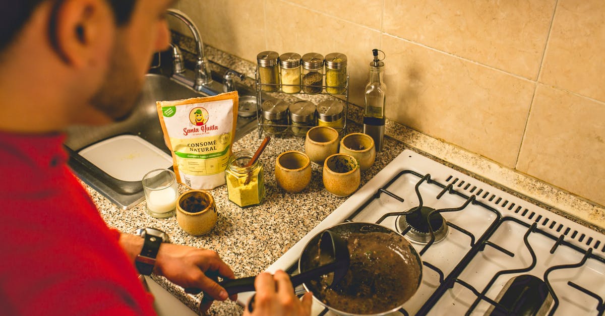 How to get spices off pan - even after washing - High Angle View of Chef Cooking