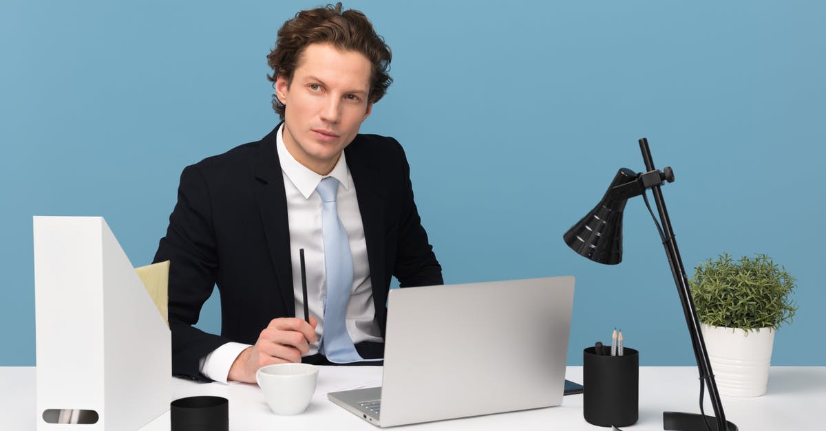 How to get those professional looking peaks on top of tiramisu? - Man Sitting With Laptop Computer on Desk and Lamp